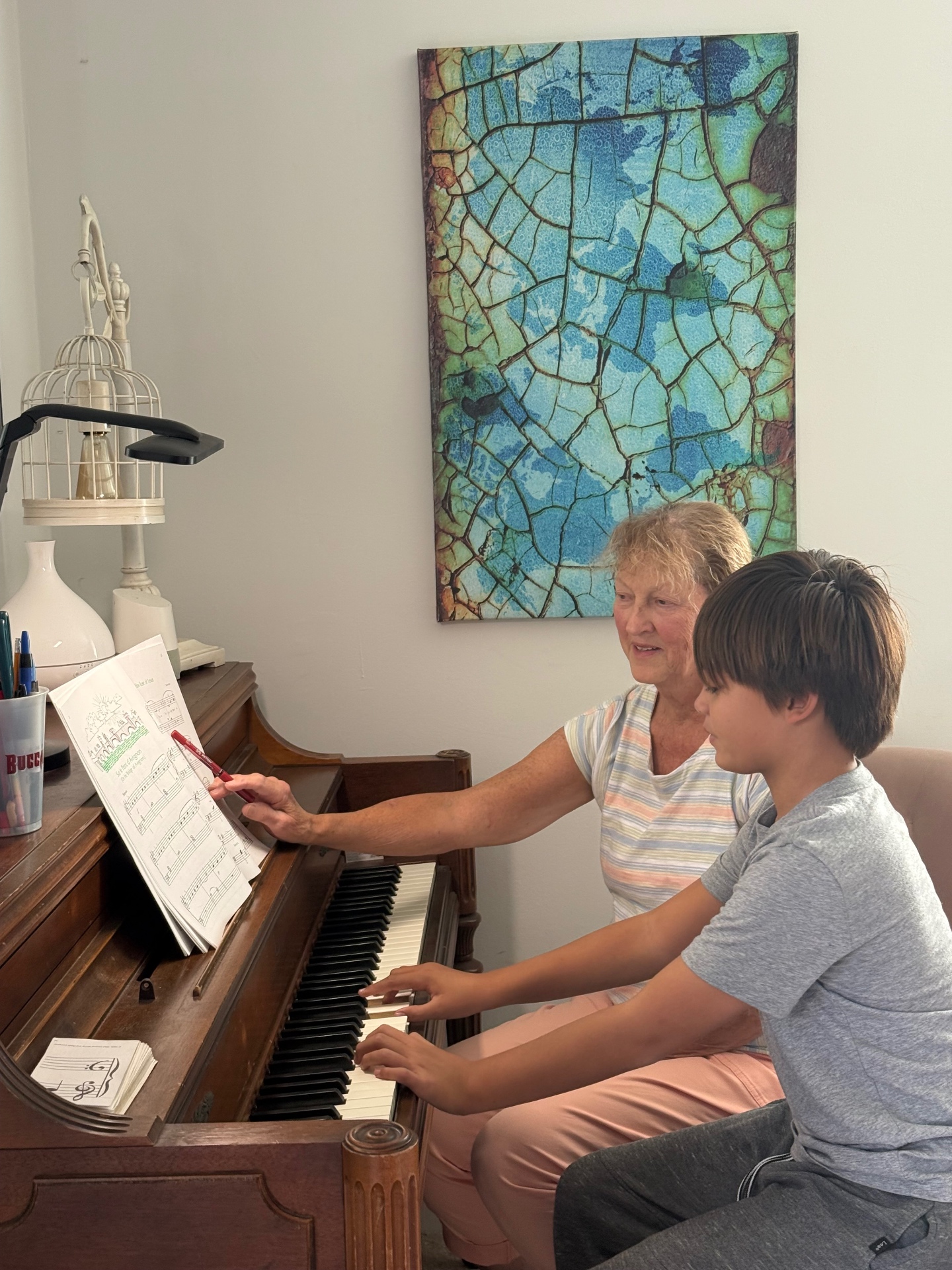Piano teacher Bonnie Ziervogel teaching a young student during a piano lesson in Costa Mesa, CA