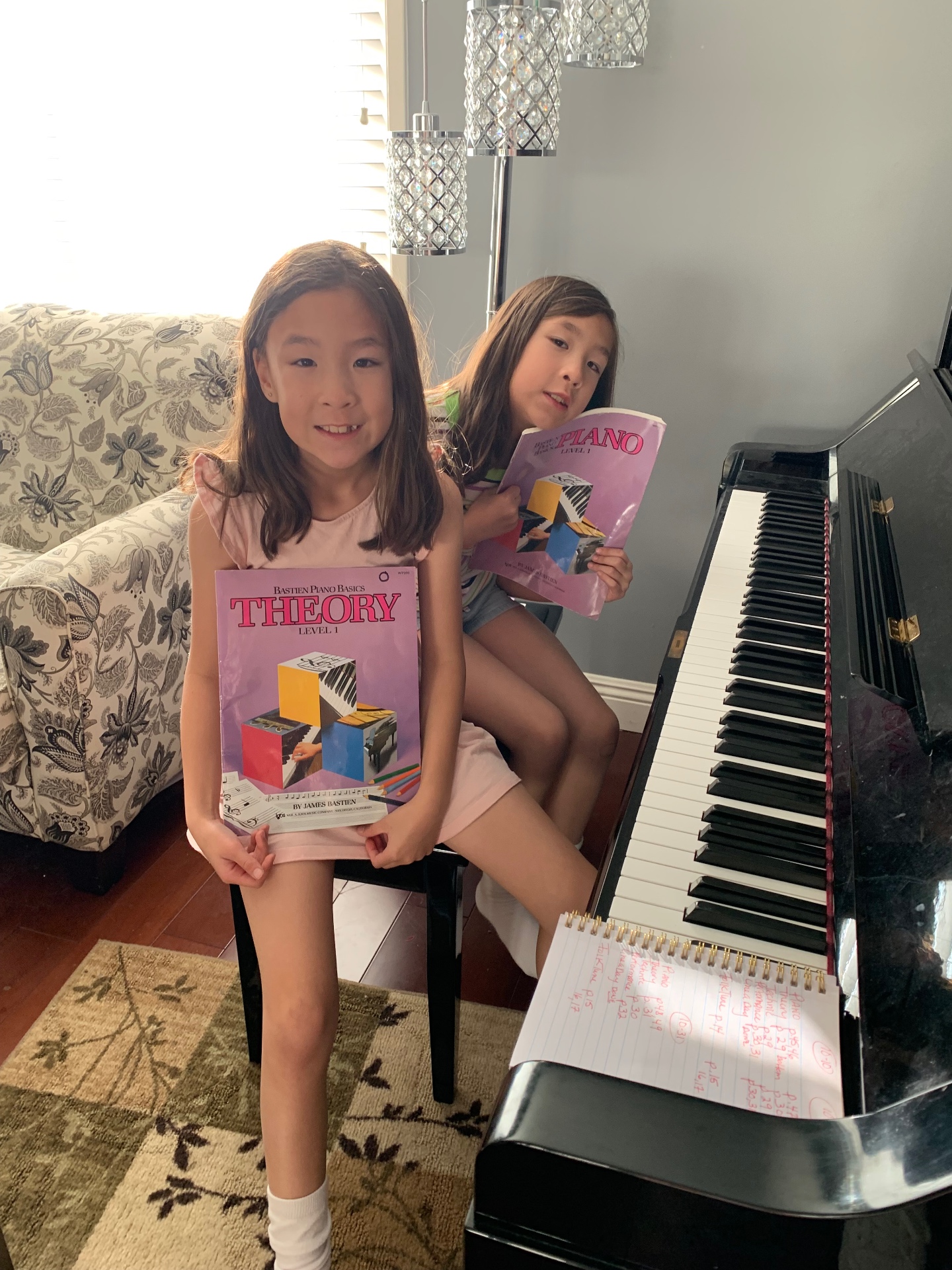 Two beginner piano students with their Bastien piano method books at a Costa Mesa piano lesson