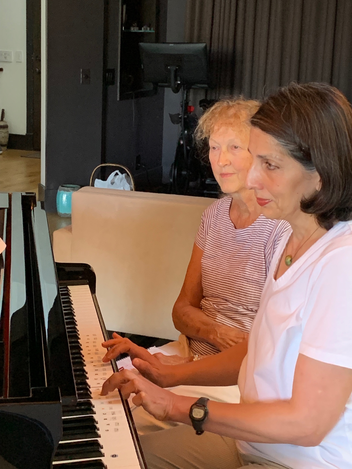 Adult beginner piano student playing piano during a private lesson in Orange County, CA